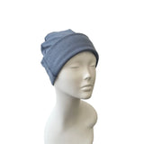 Blue beanie on a mannequin head against a white background