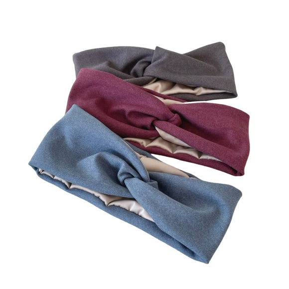 Three headbands in blue, gray, and maroon on a white background