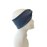 Blue headband on a mannequin head against a white background