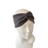 Gray headband on a mannequin head against a white background