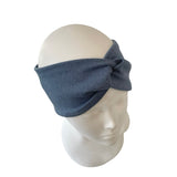 Blue headband on a mannequin head against a white background