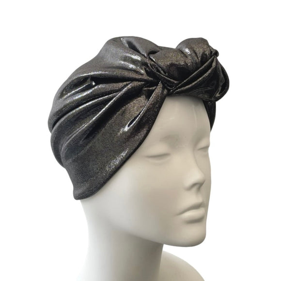 Gray headscarf on a mannequin head against a white background