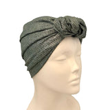 Gray textured headscarf on a mannequin head against a white background