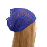 Blue lace headscarf on a mannequin head with long blonde hair against a white background
