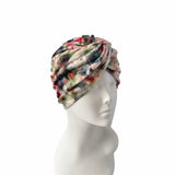 Colorful headscarf on a mannequin head against a white background