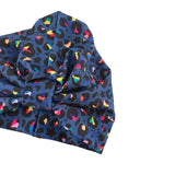 Blue fabric with colorful abstract pattern on a white background