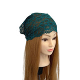 Teal lace headband on a mannequin head with long brown hair against a white background