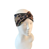 Patterned headband on a mannequin head against a white background