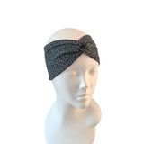 Leopard print headband on a mannequin head against a white background