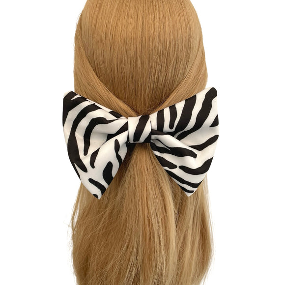 Zebra print hair scrunchie on a mannequin head with blonde hair against a white background
