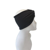 Black ribbed headband on a mannequin head against a white background