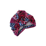 Colorful patterned headscarf on a white background