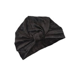 Black turban on a white background