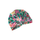 Floral patterned turban hat on a white background