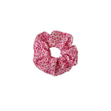 Pink leopard print scrunchie on a white background