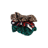 Three patterned scrunchies on a white background