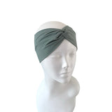 Gray headband on a mannequin head against a white background