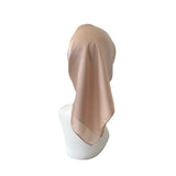Beige headscarf on a mannequin head against a white background