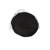 Black tire cover with a wire mesh design on a white background