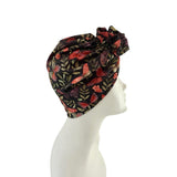 Floral patterned headscarf on a mannequin head against a white background