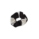 Black and white striped scrunchie on a white background