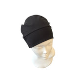 Black beanie on a mannequin head against a white background