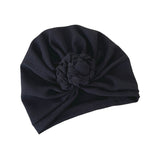 Black turban hat with a knot on a white background