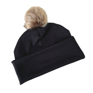 Black beanie with a fur pom-pom on a white background