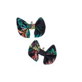 Two floral-patterned bows on a white background