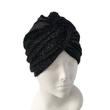 Black knit turban on a mannequin head against a white background ireland