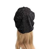 Black lace headband on a wig with blonde hair against a white background