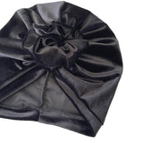 Black velvet hair turban on a white background