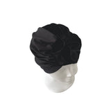 Black satin headband on a mannequin head against a white background