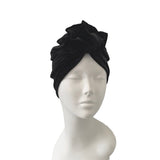 Black headscarf on a mannequin head against a white background