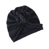Black turban with a bow on a white background