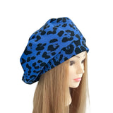 Blue leopard print headscarf on a mannequin head with long blonde hair against a white background