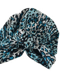Blue and black leopard print headscarf with a knot on a white background