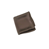 Folded brown satin sheet on a white background
