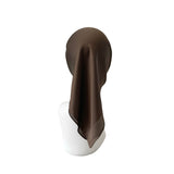 Brown fabric draped over a white cylindrical object on a white background