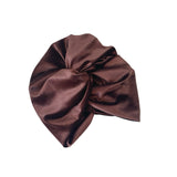 Brown satin hair turban on a white background
