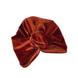 Brown velvet turban on a white background