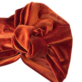 Brown velvet turban on a white background