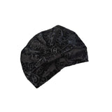 Black patterned headscarf on a white background