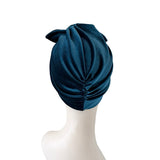 Blue headscarf on a mannequin head against a white background