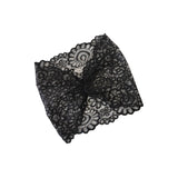 Black lace fabric on a white background