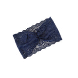 Navy blue lace headband on a white background