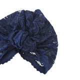 Navy blue lace headband on a white background