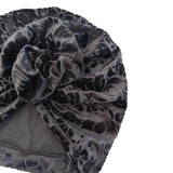 Gray patterned headscarf with a knot on a white background