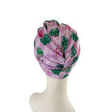 Floral patterned headscarf on a mannequin head against a white background