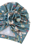 Floral and butterfly patterned fabric on a white background
